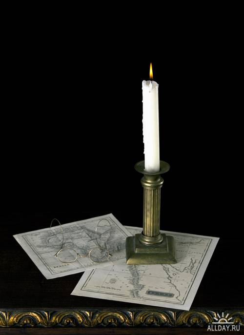 Stock Photo: A candle in old candlestick | Свеча в старинном подсвечнике
